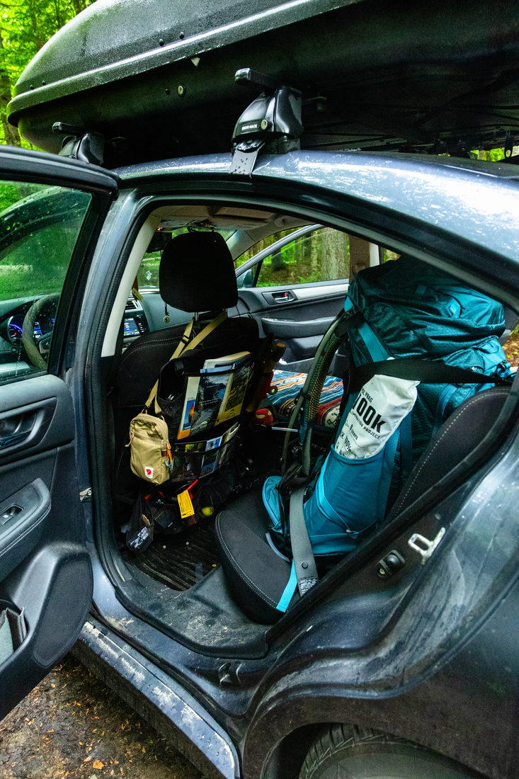 Packed gear and a backpack in the back seat